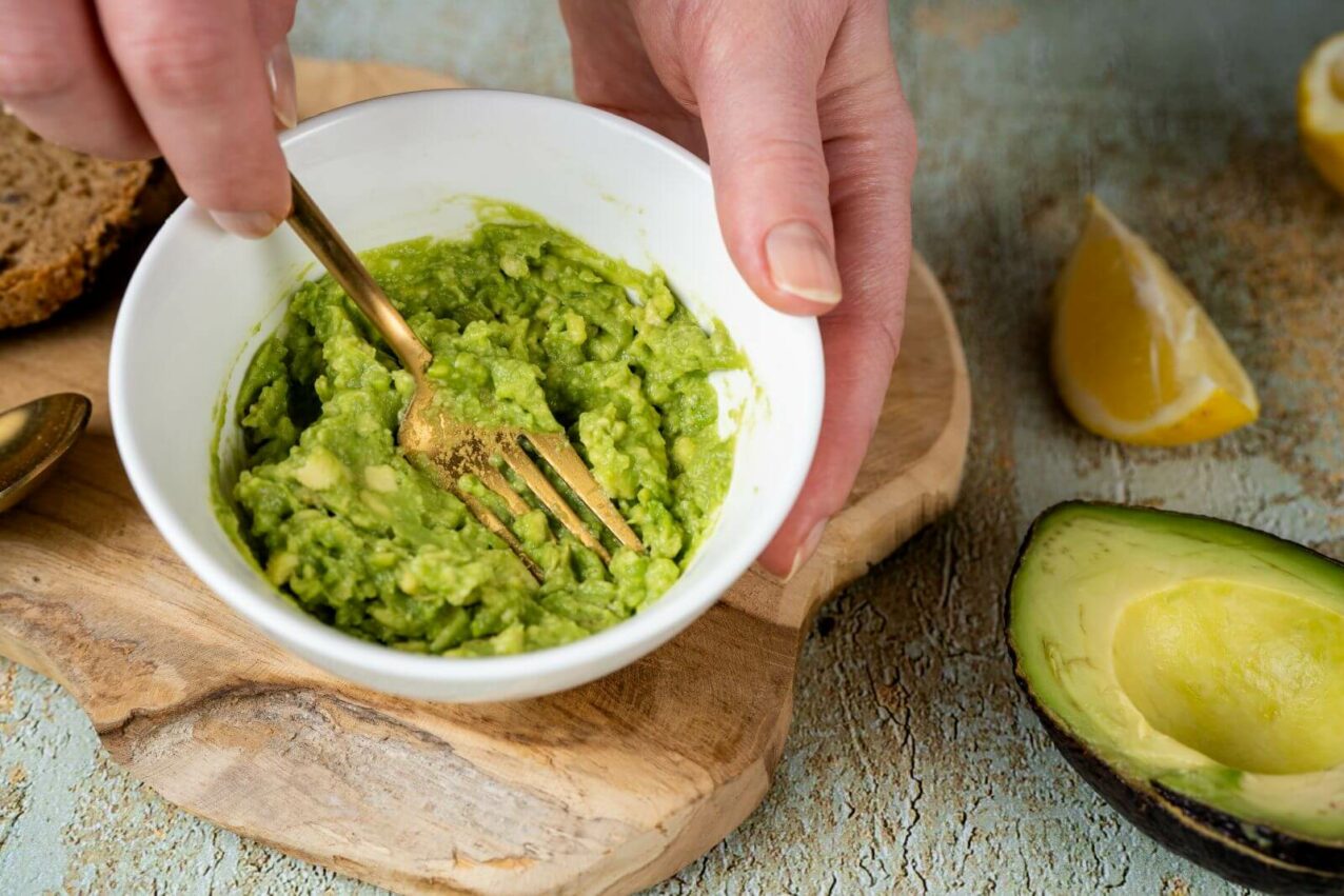 mashing avocado