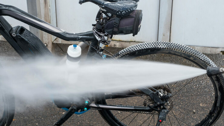 How to use the pressure hose at the car wash to clean your bike