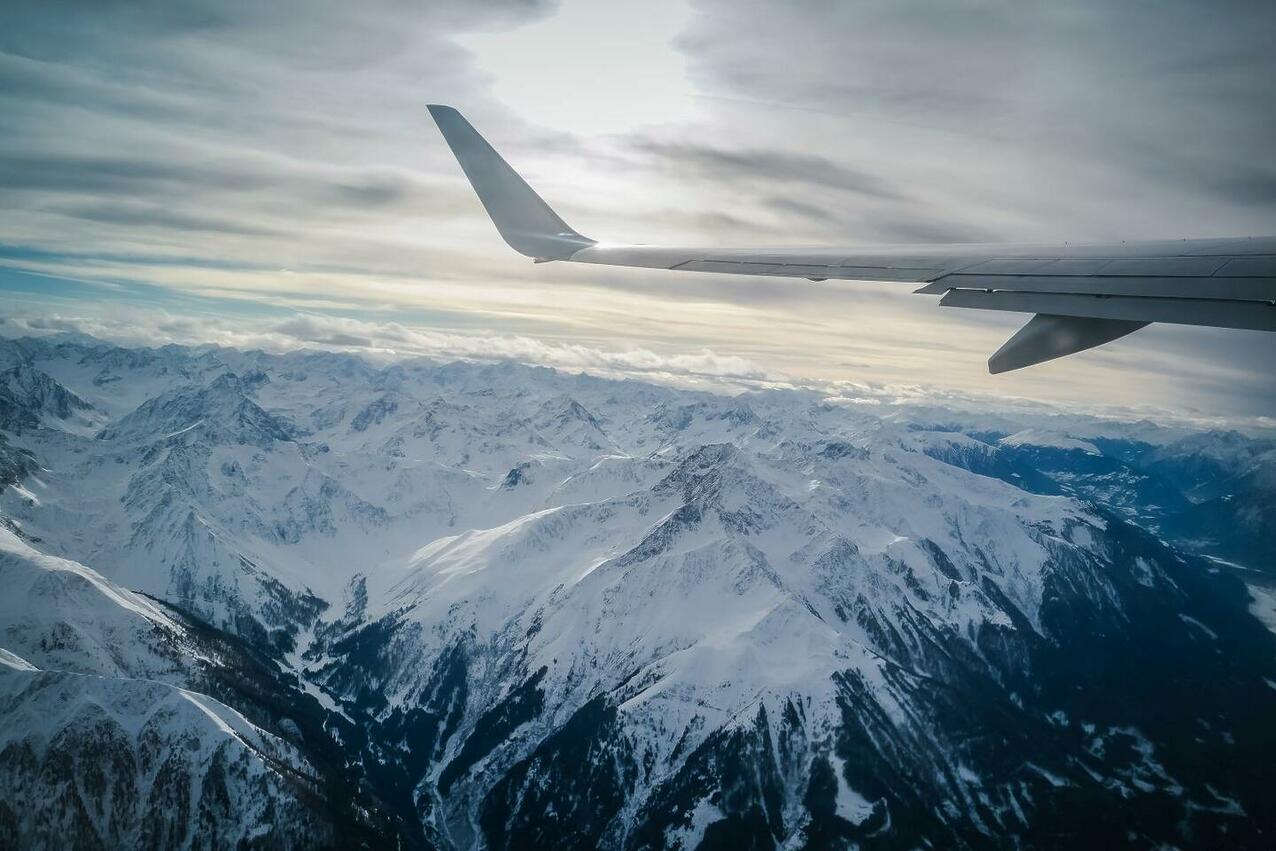 flying over snowy white mountain top view from a 2025 01 10 00 17 16 utc